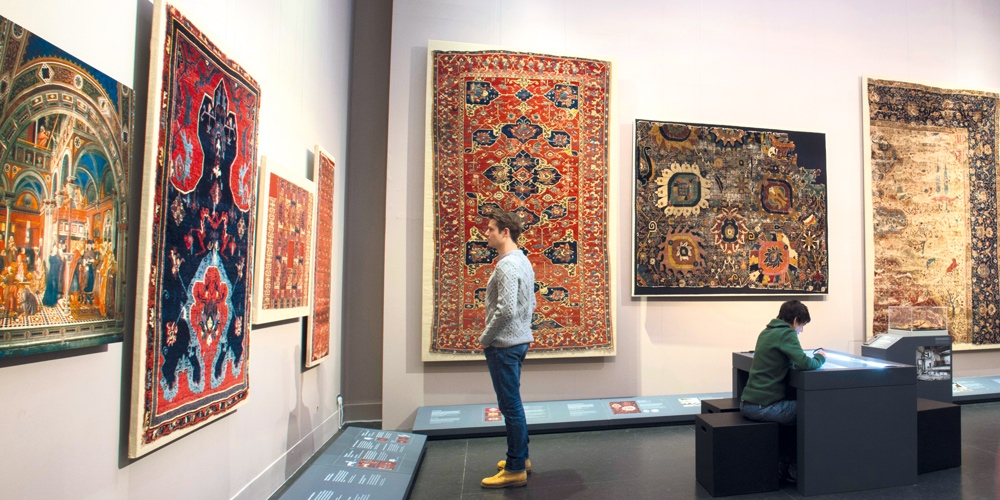 View of the new permanent carpet installation ‘Dream and Trauma’ at the Museum of Islamic Art in Berlin, showing iconic highlights from the museum’s collection such as the Bode cloudband prayer rug and the early Anatolian dragon and phoenix carpet