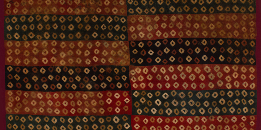 Tie dye childs tunic (detail), Wari culture, Southern Andes, camelid fibres, c800 AD, 1.60 x 1.30 m. Paul Hughes Collection