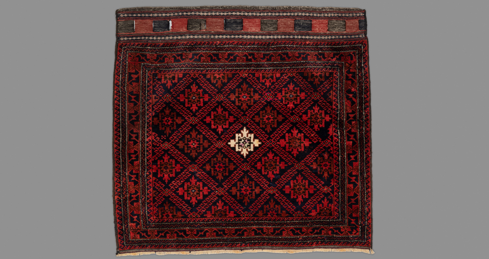 Large Baluch bag face with central ‘snowflake’ medallion and silk highlights, Khorasan province, northeast Persia, late 19th century. 0.92 x 0.97 m (3' 0" x 3' 2") 