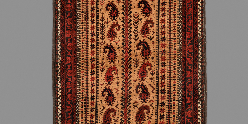 Baluch namazlik prayer rug with the so-called ‘scorpion boteh tree of life’ design (detail), Timuri tribe, Yacoub Khani sub tribe, northwest Afghanistan, late 19th century. Note the unusual centipedes flanking the botehs towards the bottom of the base of the tree. 0.85 x 1.68 m (2' 9" x 5' 6")
